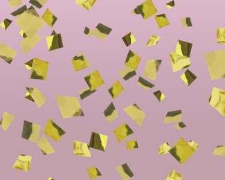 Shiny golden confetti falling on dusty pink background