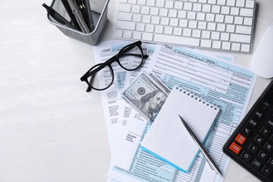 Photo of Tax accounting. Flat lay composition with stationery and documents on light grey table. Space for text