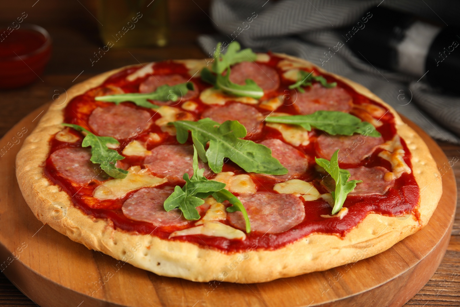 Photo of Delicious homemade pita pizza on wooden board, closeup