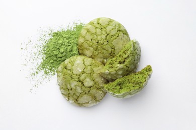 Tasty matcha cookies and powder on white background, top view