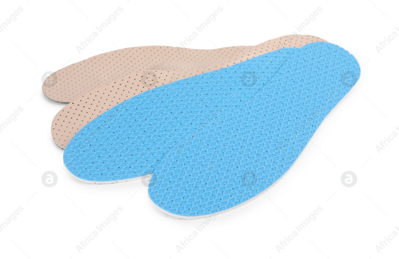 Photo of Two pairs of insoles on white background