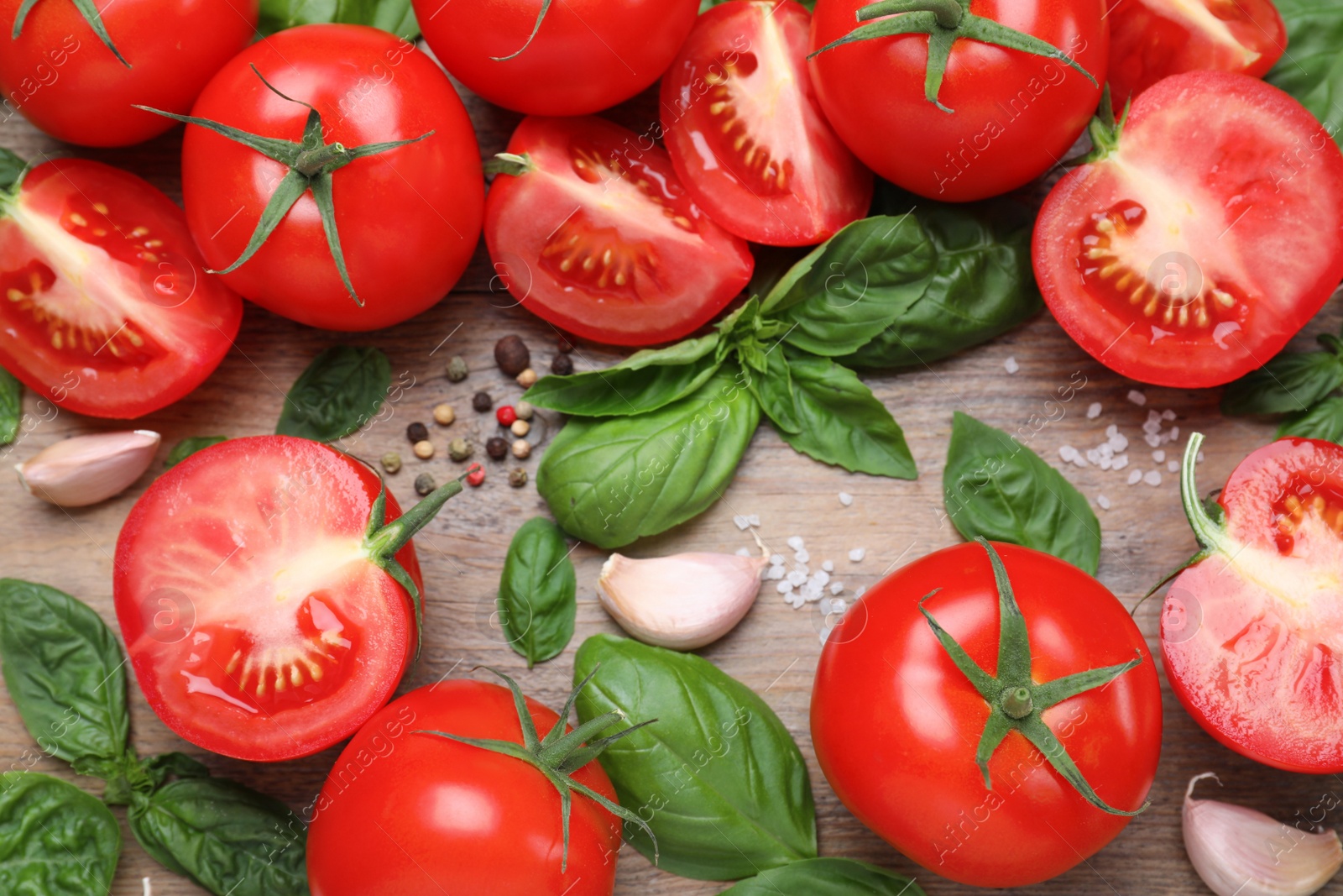 Photo of Flat lay composition with fresh green basil leaves on wooden table