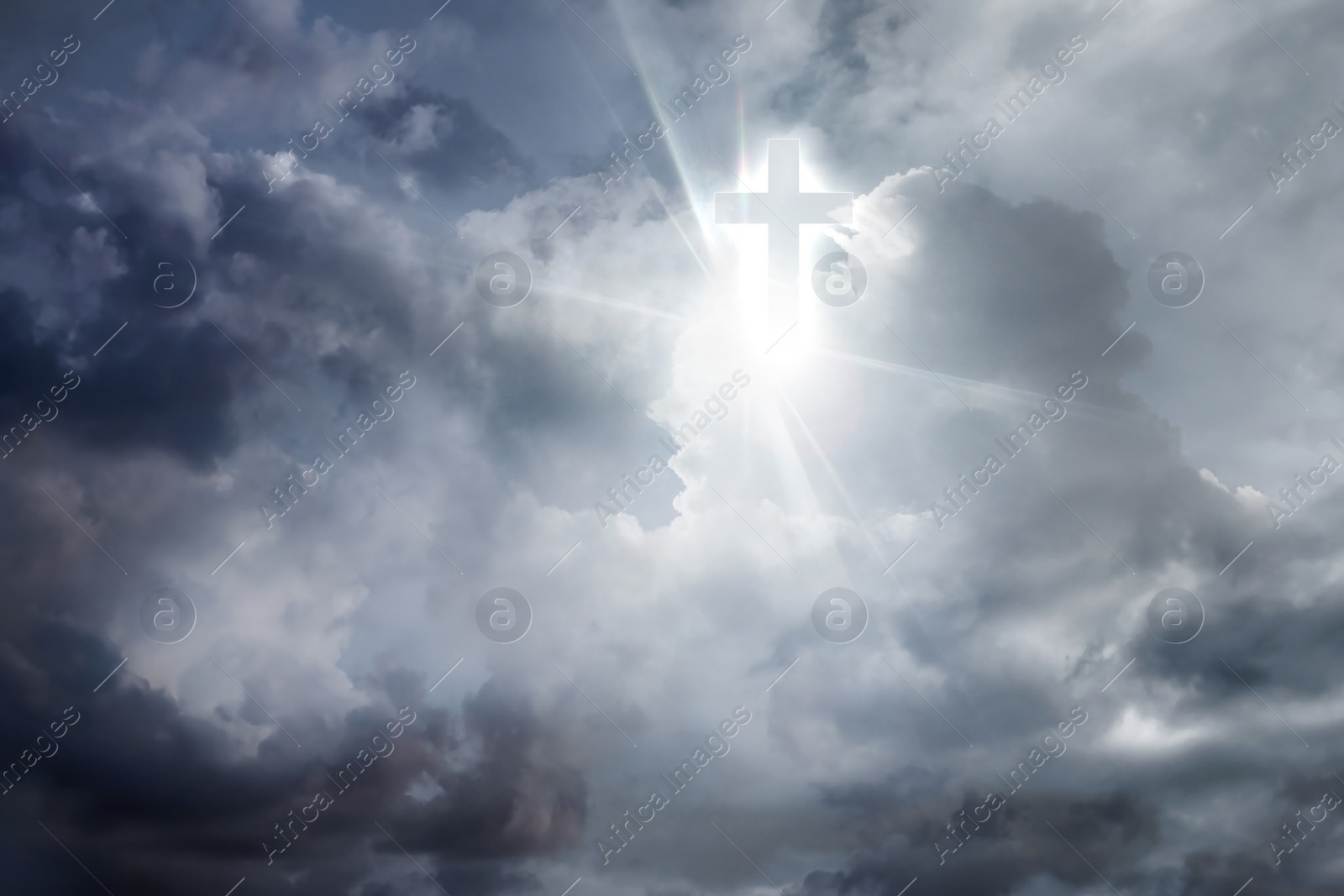 Image of Cross silhouette in cloudy sky. Resurrection of Jesus