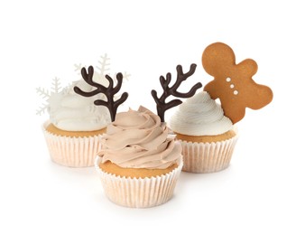 Different beautiful Christmas cupcakes on white background