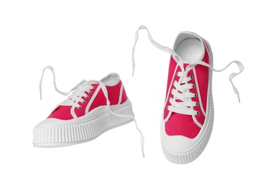 Pair of red classic old school sneakers on white background