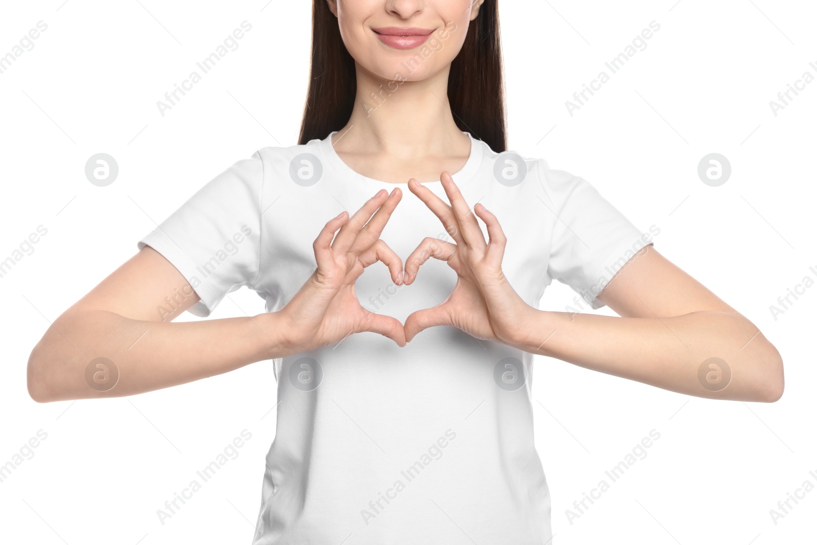 Photo of Happy woman showing heart on white background, closeup