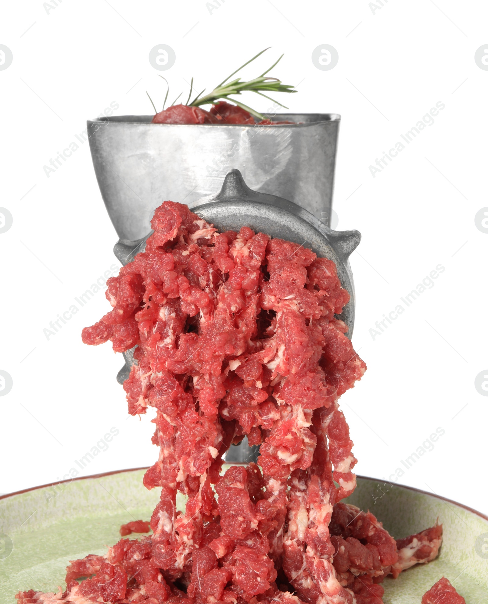 Photo of Metal meat grinder with minced beef and plate isolated on white