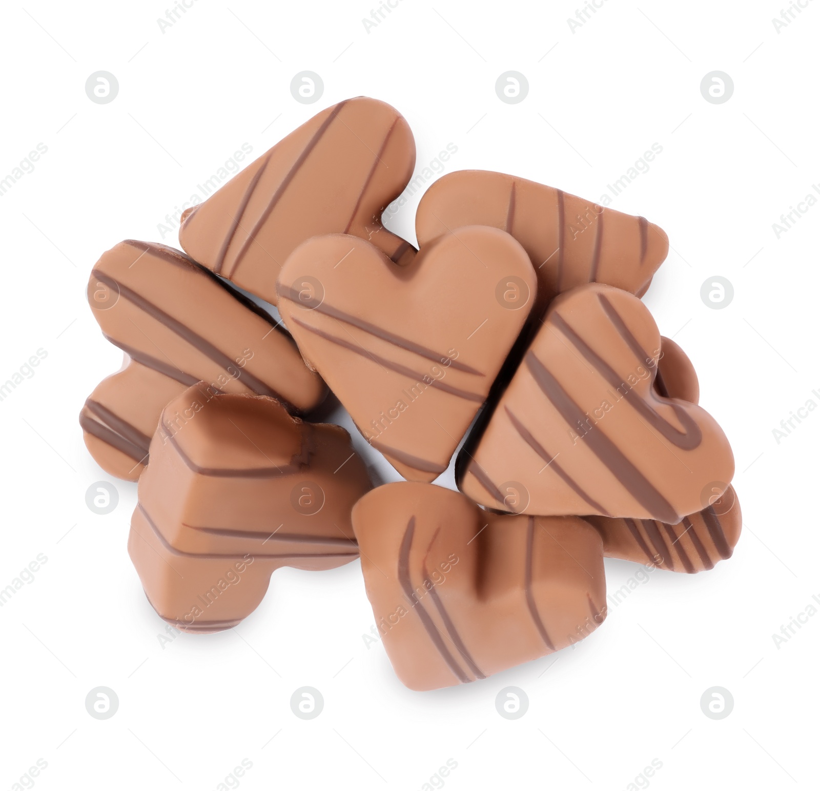 Photo of Delicious heart shaped chocolate candies on white background, top view