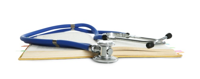 Photo of Stethoscope and open book isolated on white