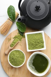 Photo of Flat lay composition with green matcha powder on white table