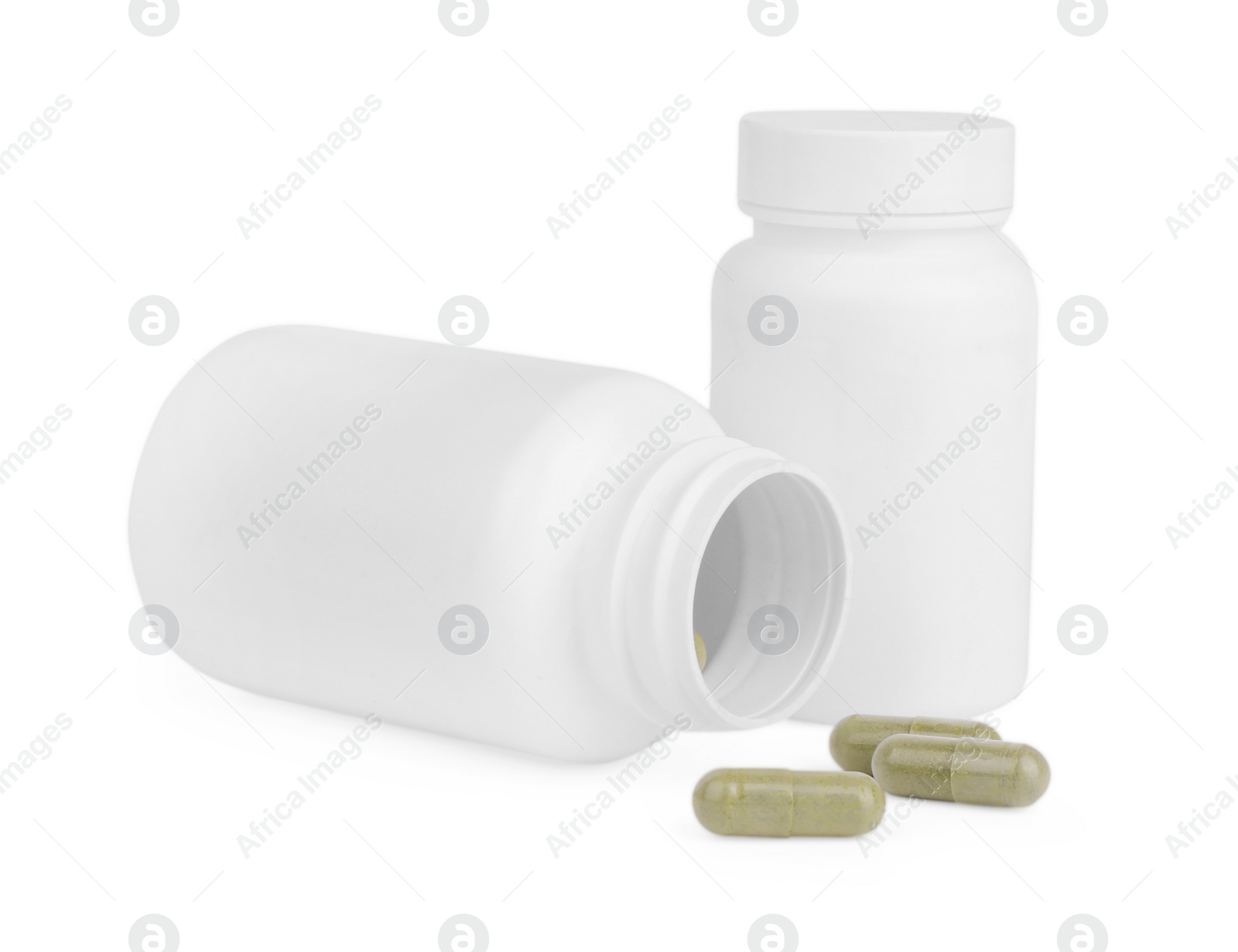 Photo of Vitamin capsules and medical bottles isolated on white