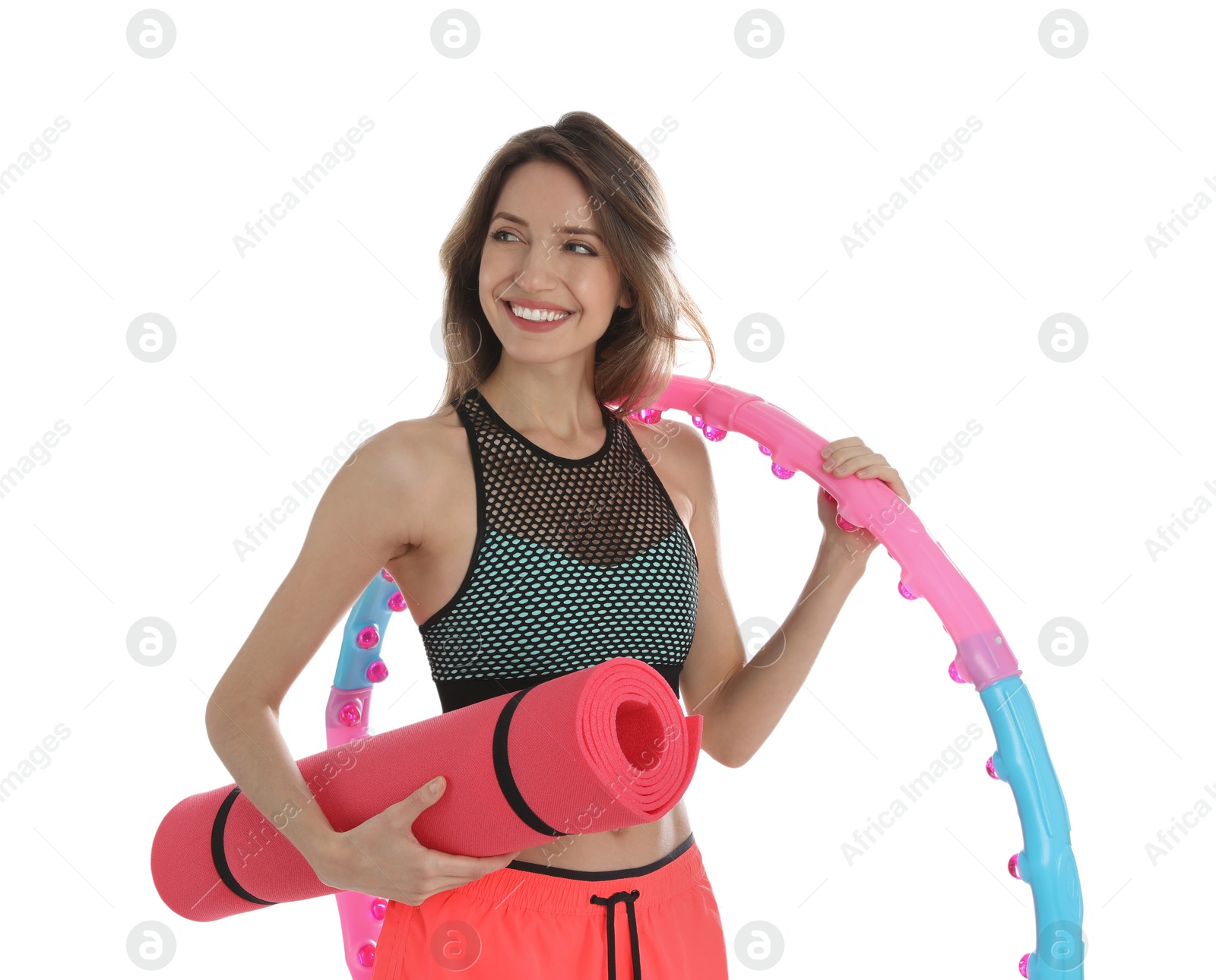 Photo of Beautiful woman with yoga mat and hula hoop on white background