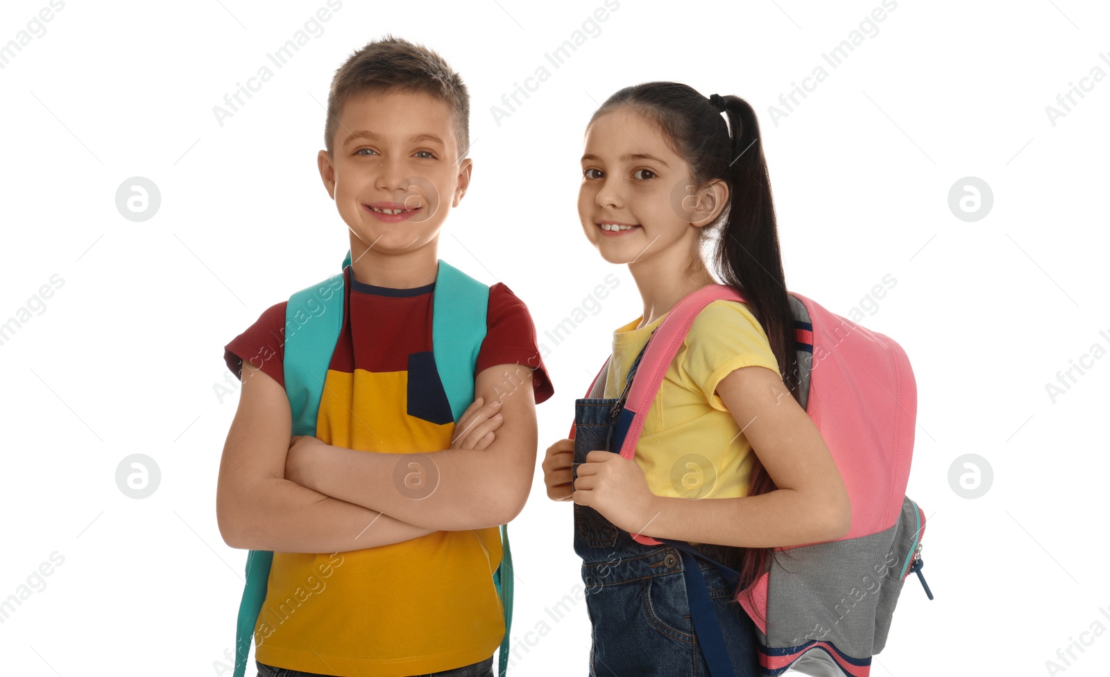 Photo of Little school children with backpacks on white background