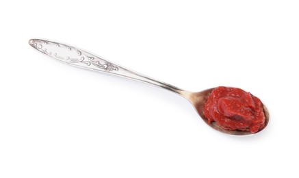 Photo of Spoon of tasty tomato paste isolated on white, top view