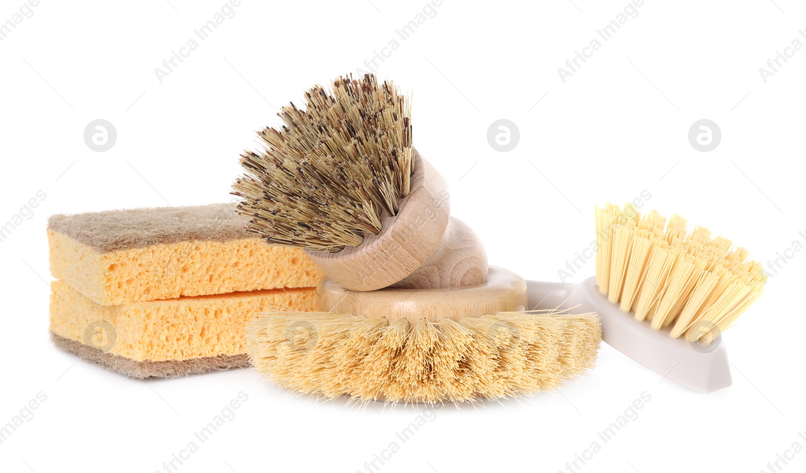 Photo of Cleaning supplies. Different brushes and sponges isolated on white