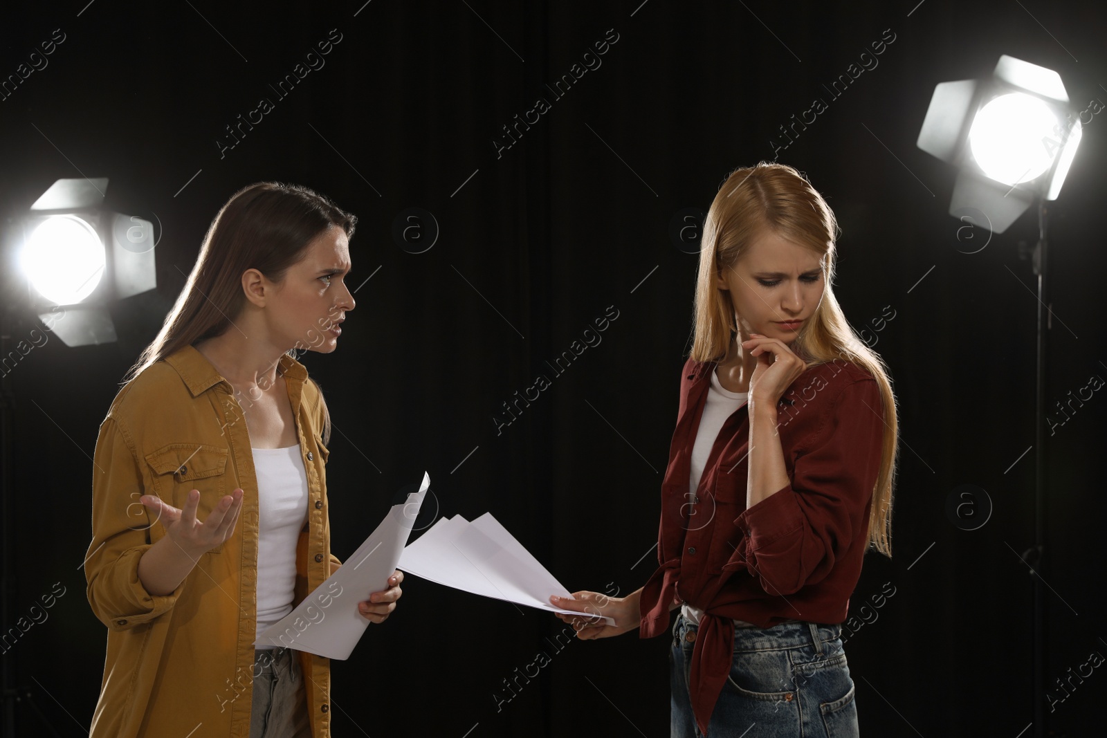 Photo of Professional actresses rehearsing on stage in theatre