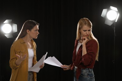 Professional actresses rehearsing on stage in theatre