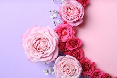 Photo of Flat lay composition with flowers and space for text on color background