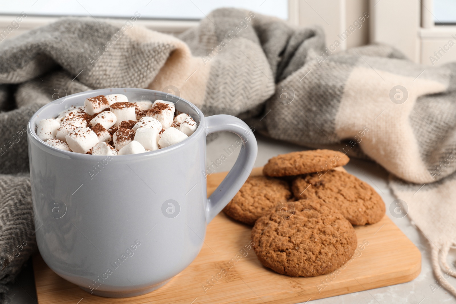 Photo of Composition with cup of cocoa and cookies on windowsill. Winter drink