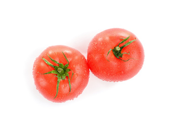 Fresh ripe organic tomatoes with water drops isolated on white, top view