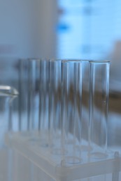 Laboratory analysis. Glass test tubes on table indoors, closeup