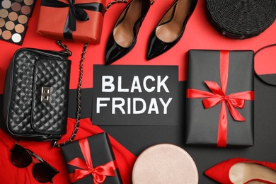 Gift boxes, shoes, women's accessories and phrase Black Friday on color background, flat lay