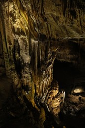 Photo of Picturesque view of many stalactite formations in cave