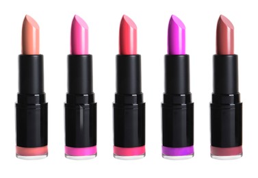 Set with different beautiful lipsticks on white background