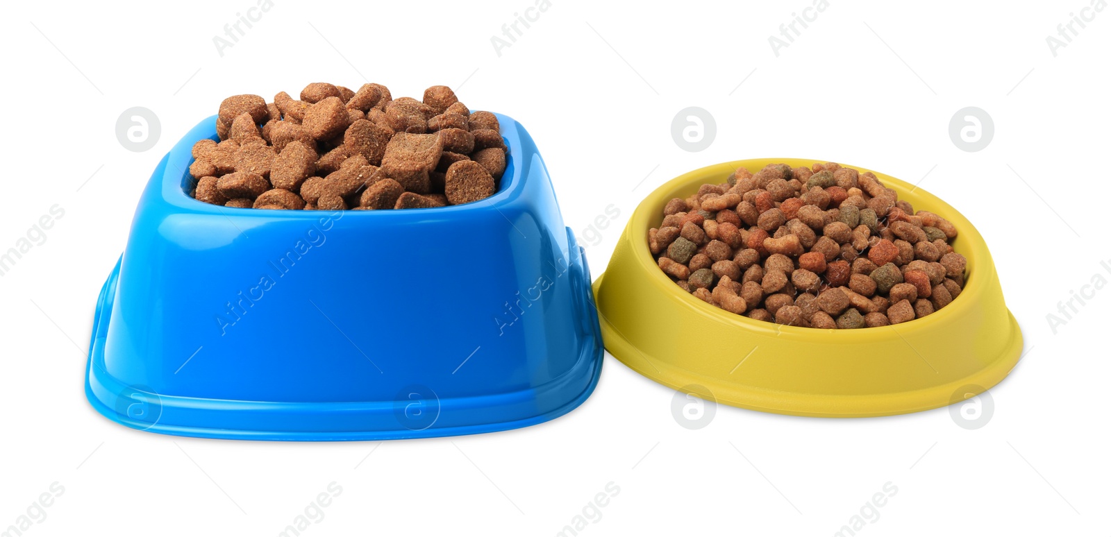 Photo of Dry pet food in feeding bowls on white background