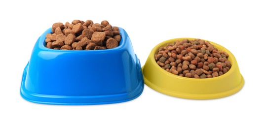 Photo of Dry pet food in feeding bowls on white background