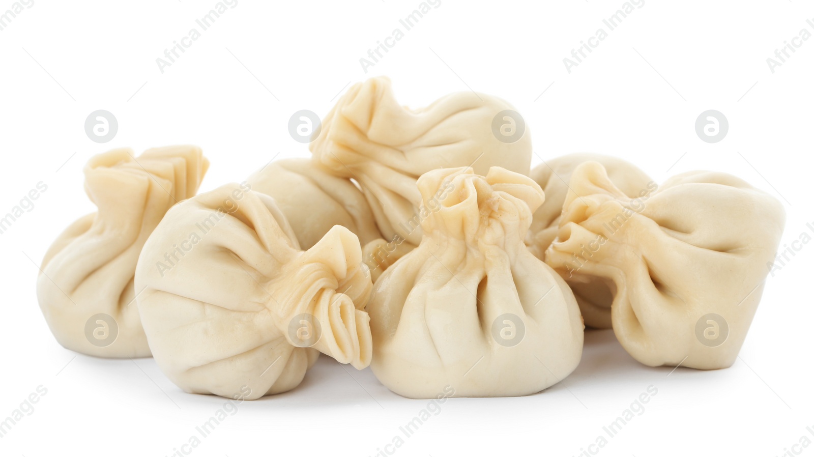 Photo of Boiled dumplings with tasty filling on white background