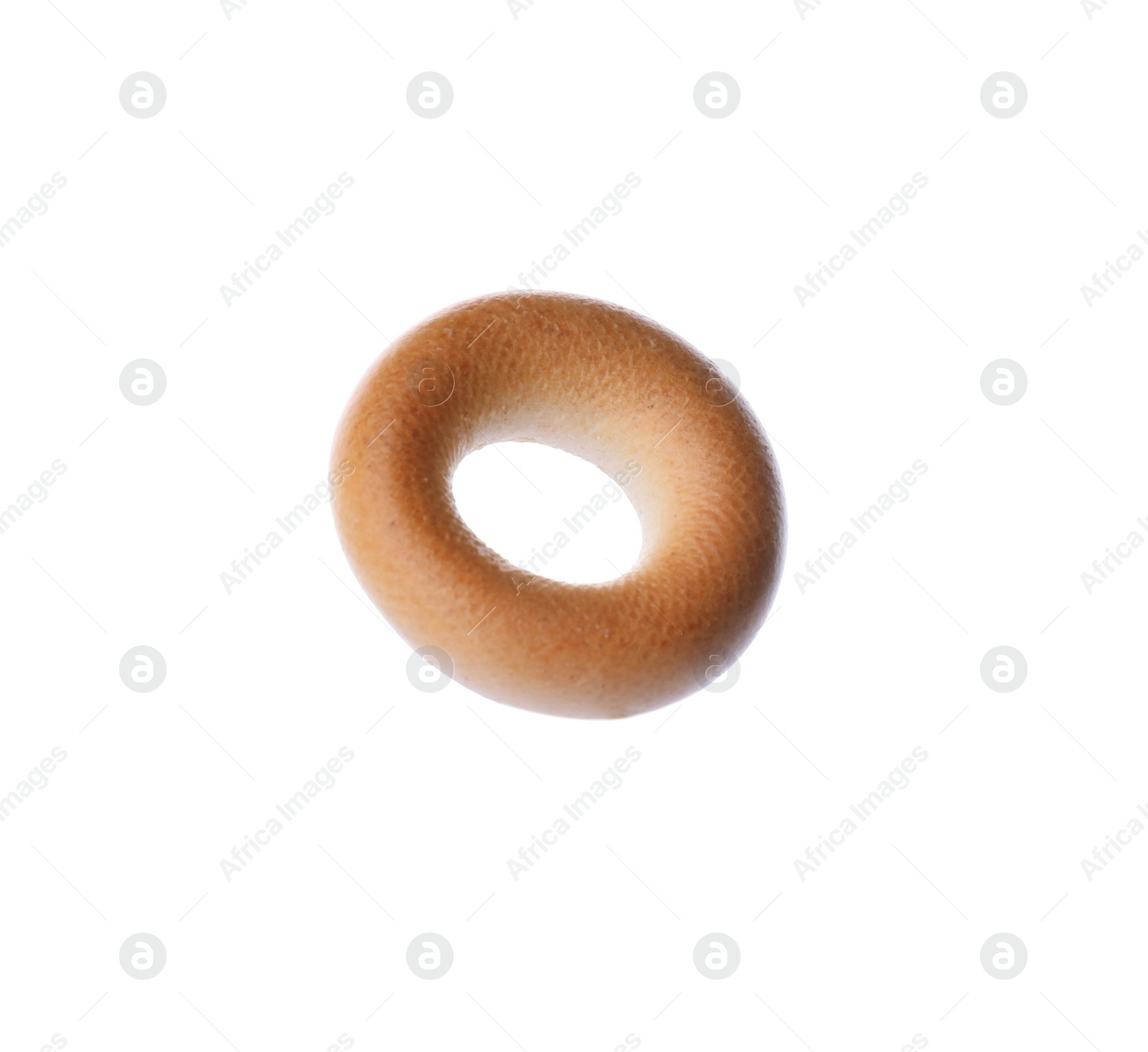 Photo of One tasty dry bagel (sushka) isolated on white