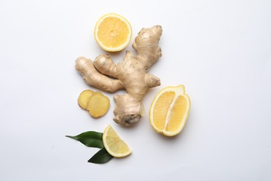 Photo of Fresh lemons and ginger on white background, flat lay