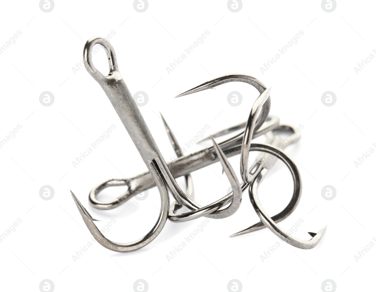 Photo of Metal hooks on white background. Fishing accessories