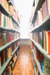 Photo of Blurred view of books on shelves in library