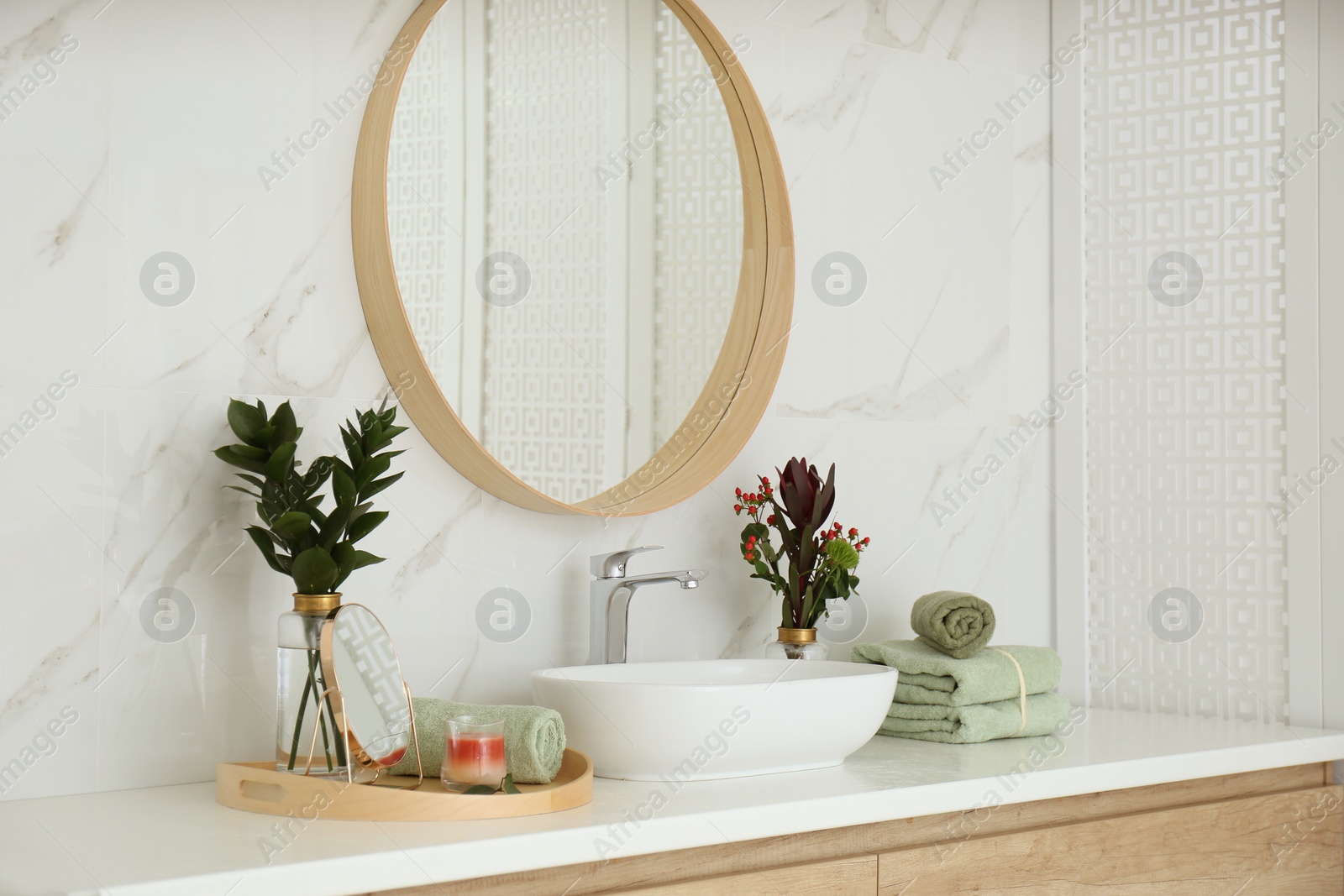 Photo of Modern bathroom interior with stylish mirror and vessel sink