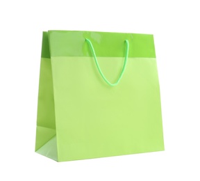 Photo of Green paper shopping bag isolated on white