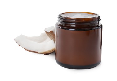 Photo of Jar of hand cream and coconut pieces on white background