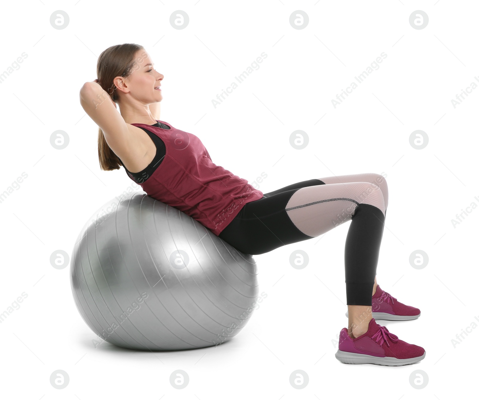 Photo of Young woman doing sports exercises isolated on white. Home fitness