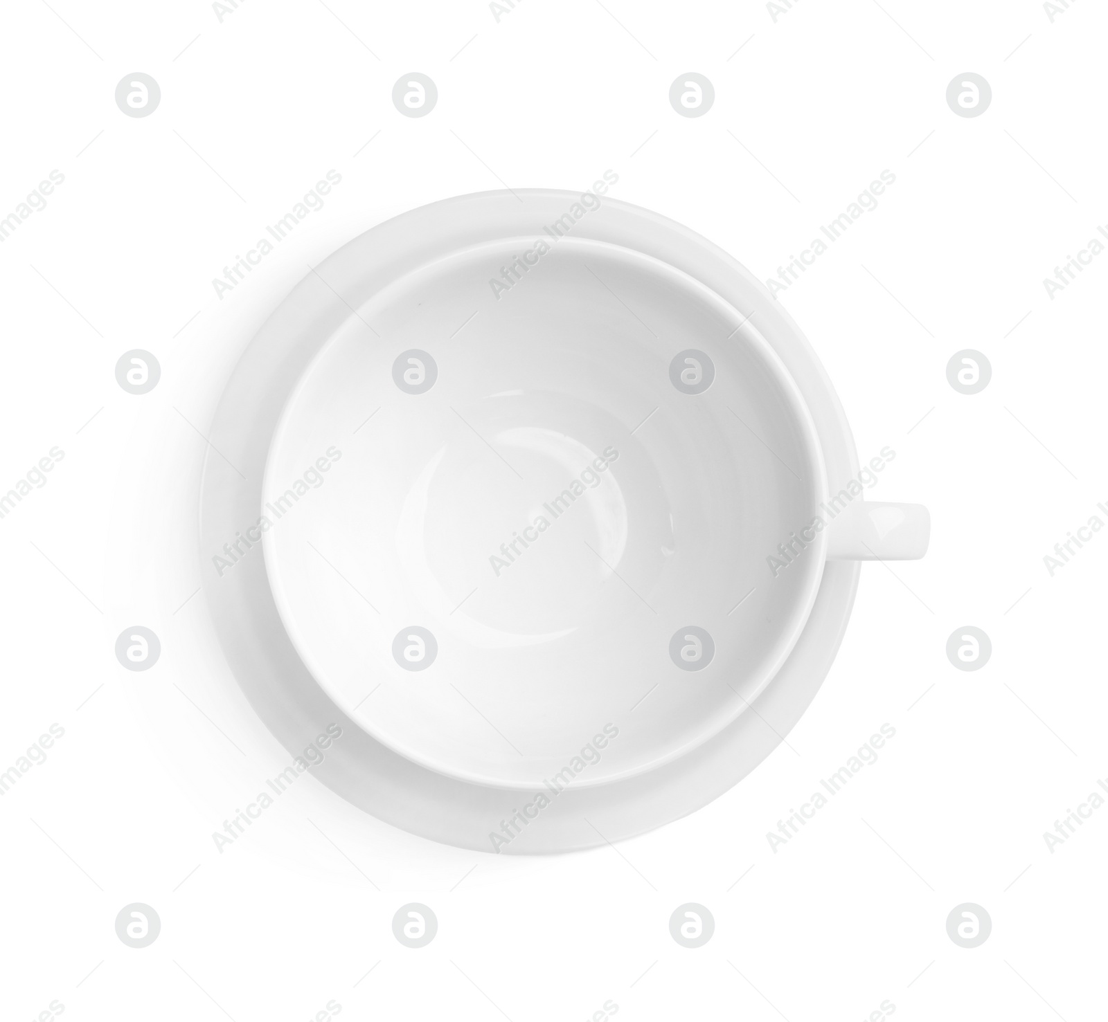 Photo of Ceramic cup and saucer isolated on white, top view