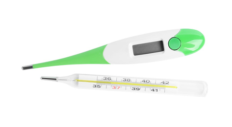 Different thermometers on white background, top view