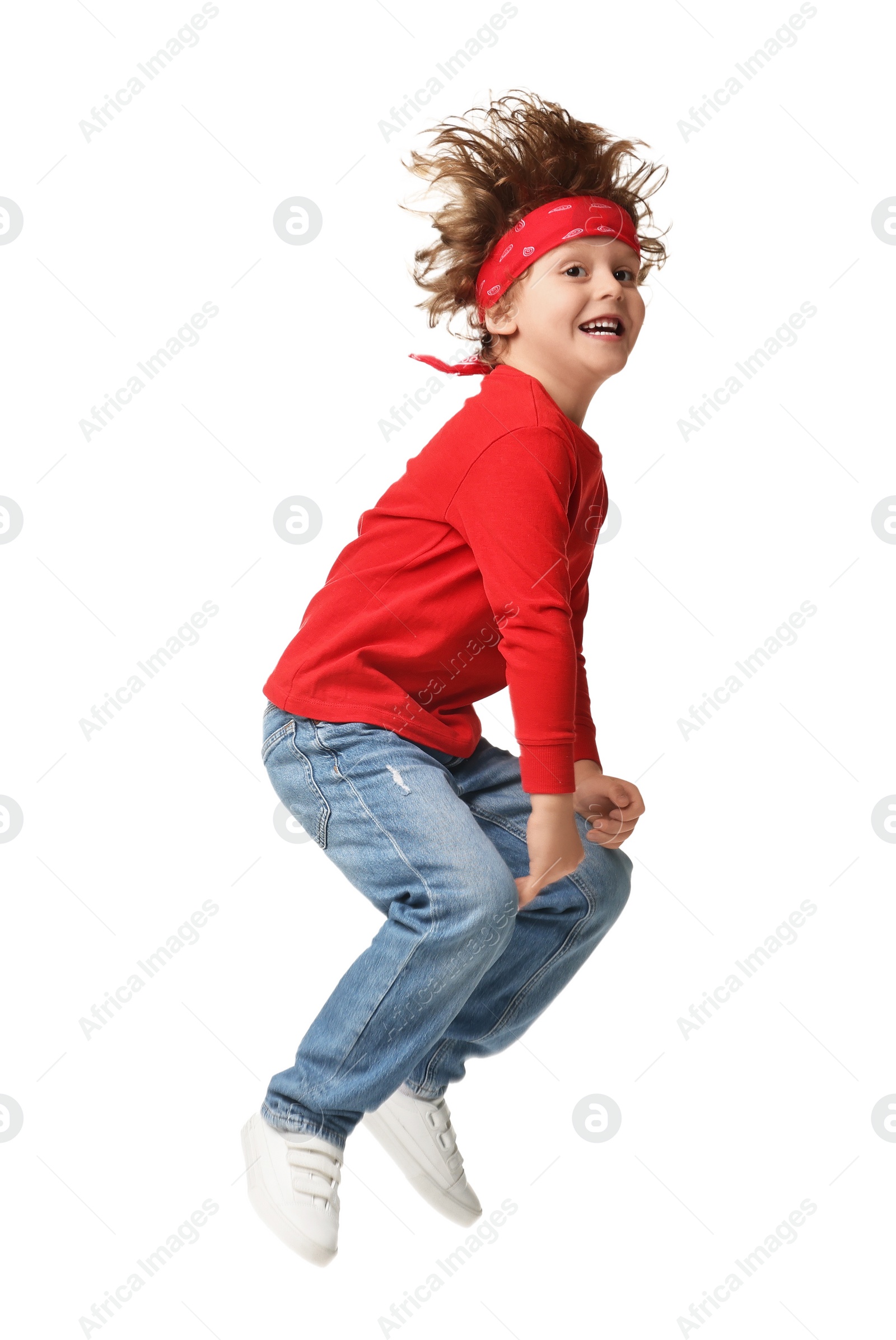 Photo of Happy little boy dancing on white background