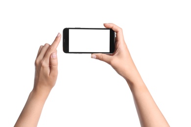 Photo of Young woman holding mobile phone with blank screen in hands on white background