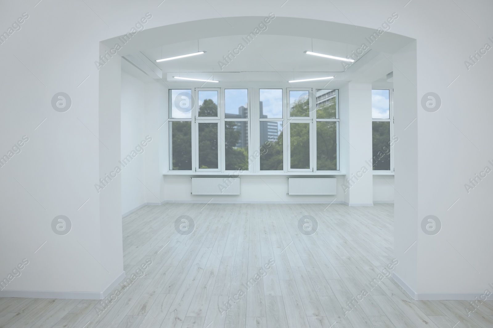 Photo of New empty room with clean windows and white walls