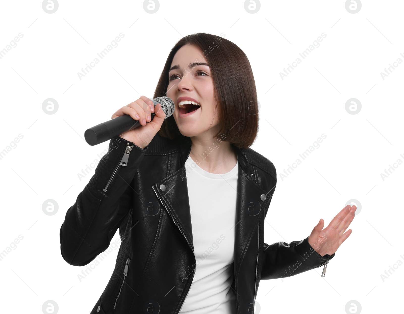 Photo of Beautiful young woman with microphone singing on white background