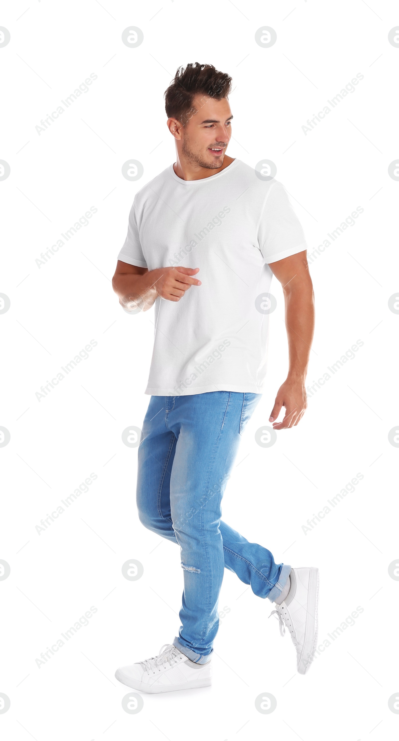 Photo of Young man in stylish jeans on white background