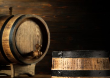 Image of Wooden barrels in cellar, selective focus. Space for text