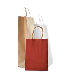 Photo of Mockup of paper shopping bags on white background