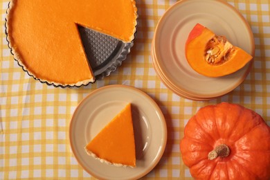 Photo of Delicious homemade pie and pumpkins on table, flat lay