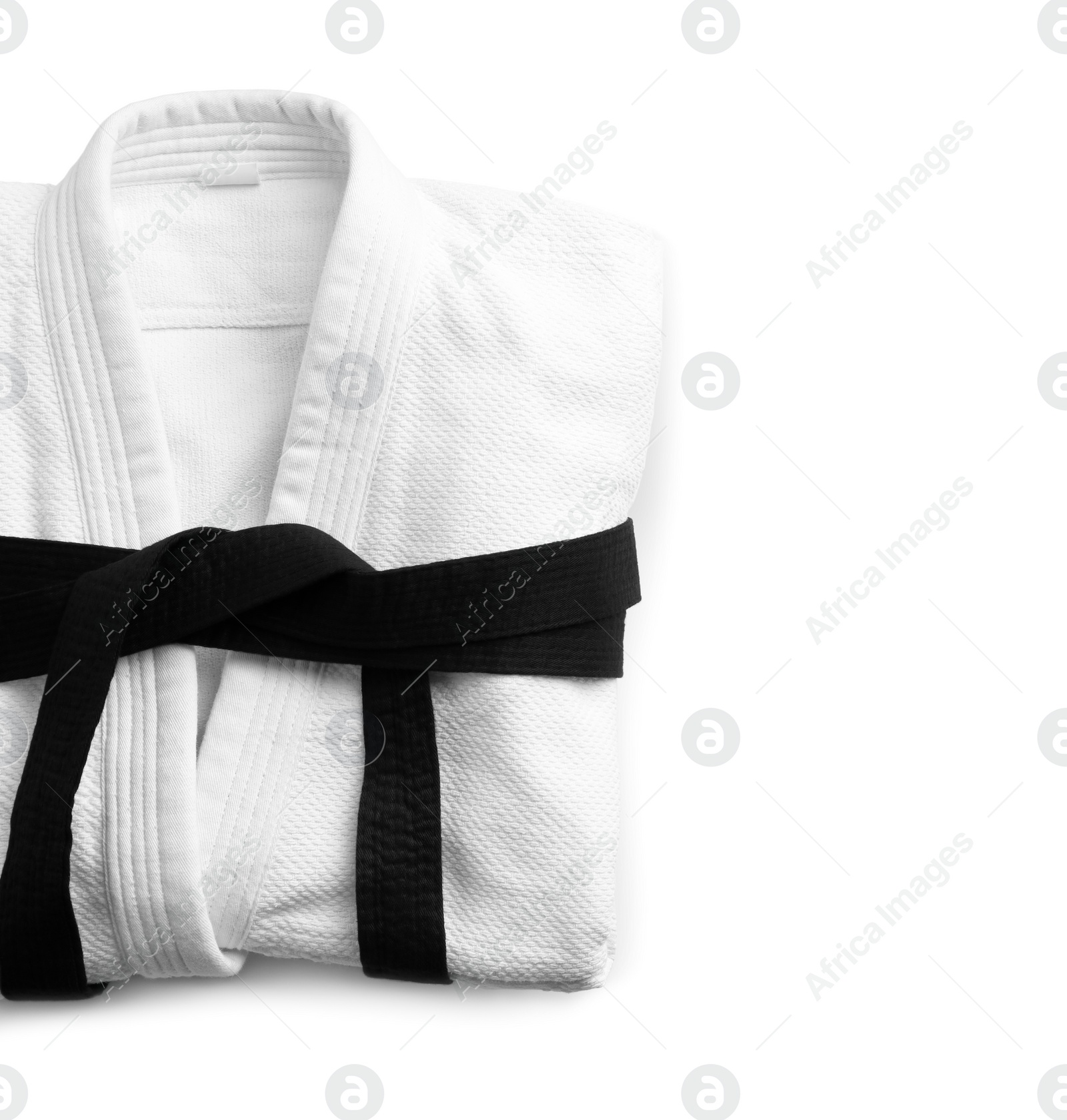 Photo of Martial arts uniform with black belt on white background, top view